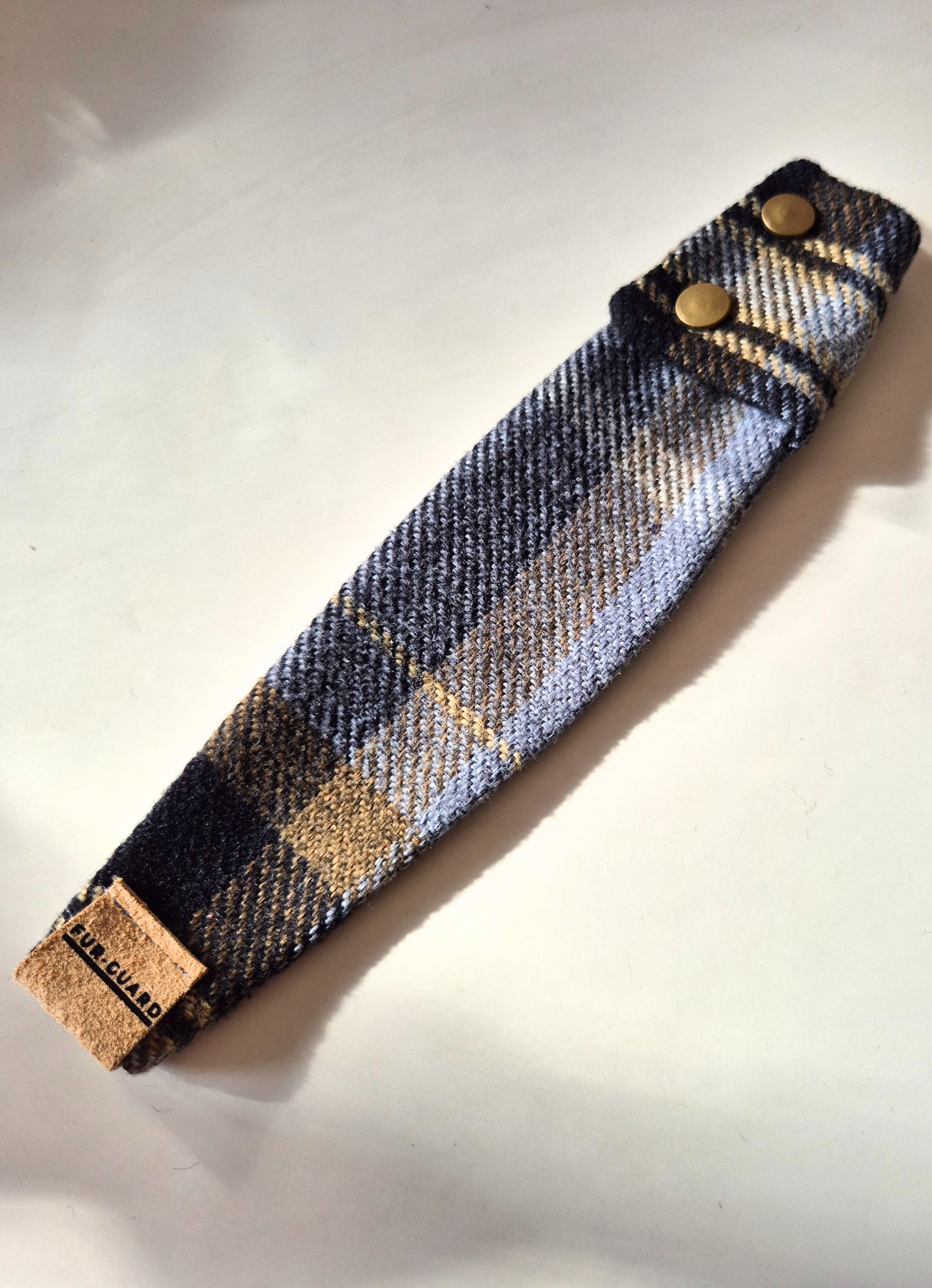 Black and gold collar cover